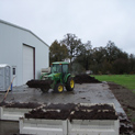 Tractor Moving Mushroom Compost